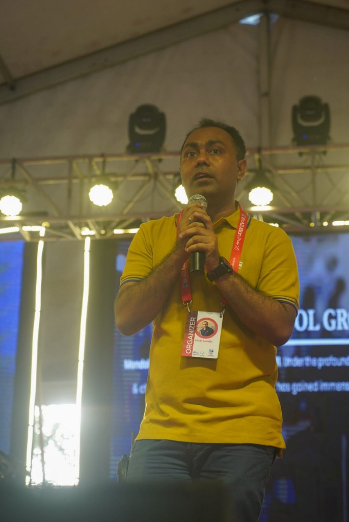 Sakif Ahmed speaking on stage